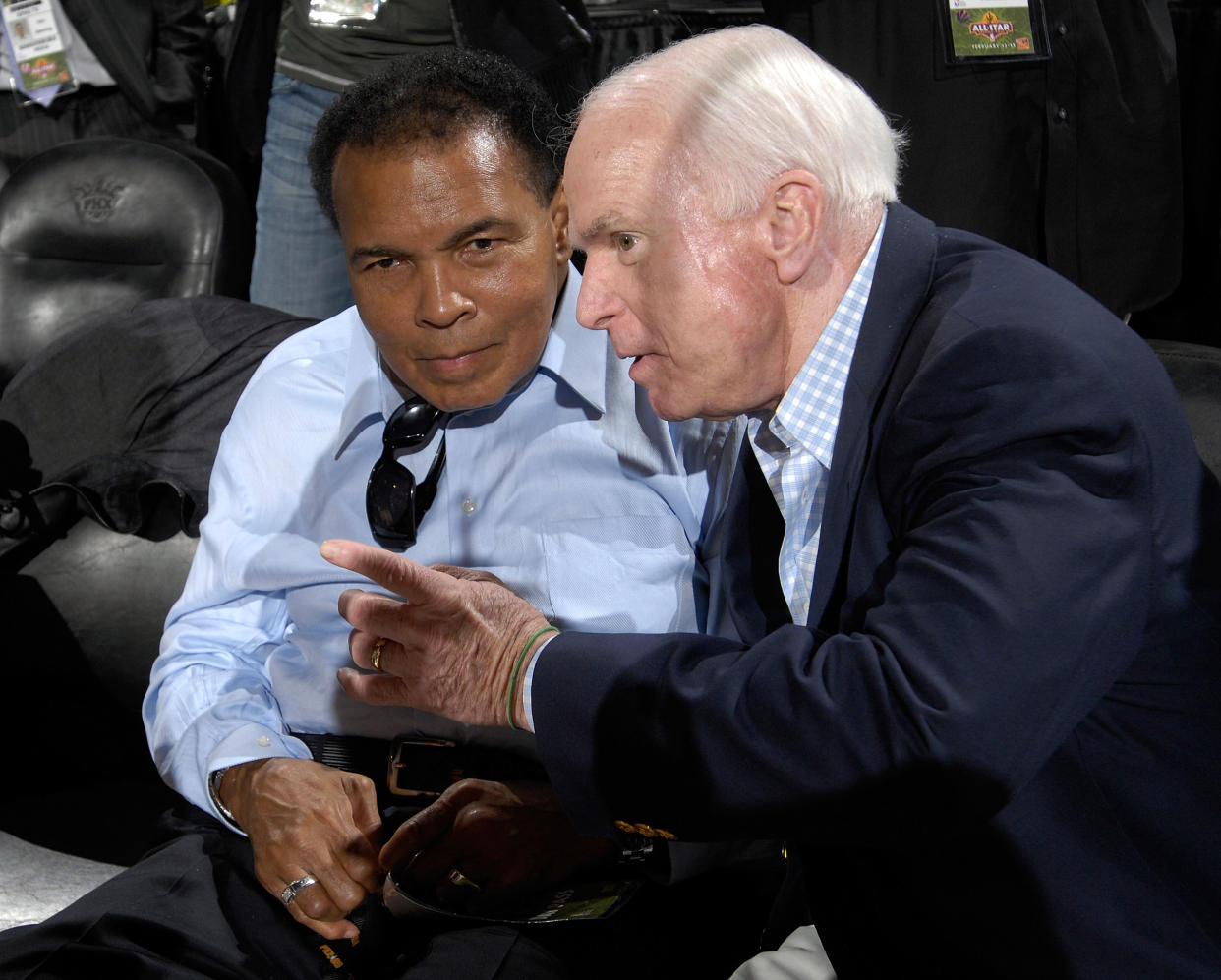 Sen. John McCain (R), who died Saturday at 81 after a battle with brain cancer, talks to his hero, former boxing heavyweight champion Muhammad Ali, at the 2009 NBA All-Star Game. (Getty Images)