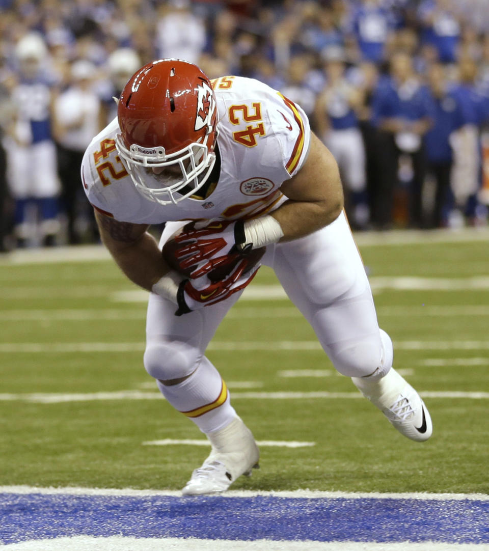 Kansas City Chiefs' Anthony Sherman (42) scores on a five-yard touchdown reception during the first half of an NFL wild-card playoff football game against the Indianapolis Colts Saturday, Jan. 4, 2014, in Indianapolis. (AP Photo/Michael Conroy)