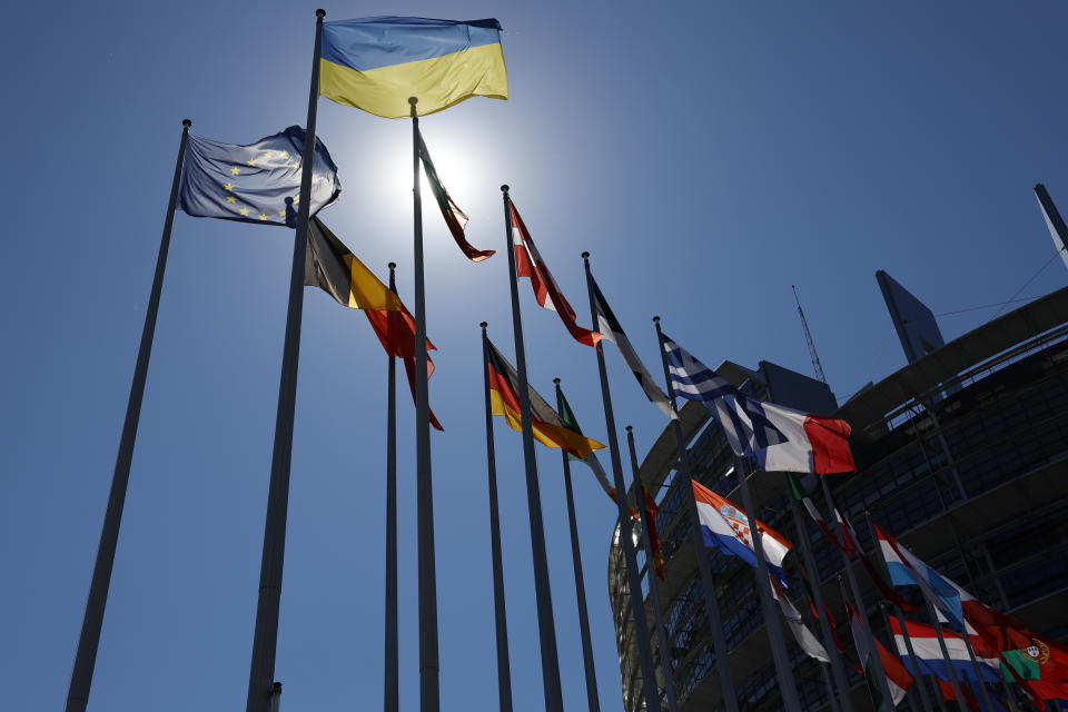 The Ukrainian flag, top, flies with others European flags outside the European Parliament , Tuesday, July 5, 2022 in Strasbourg, eastern France. (AP Photo/Jean-Francois Badias)