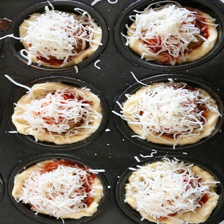 Crescent dough topped with meatballs, marinara sauce, and shredded cheese.