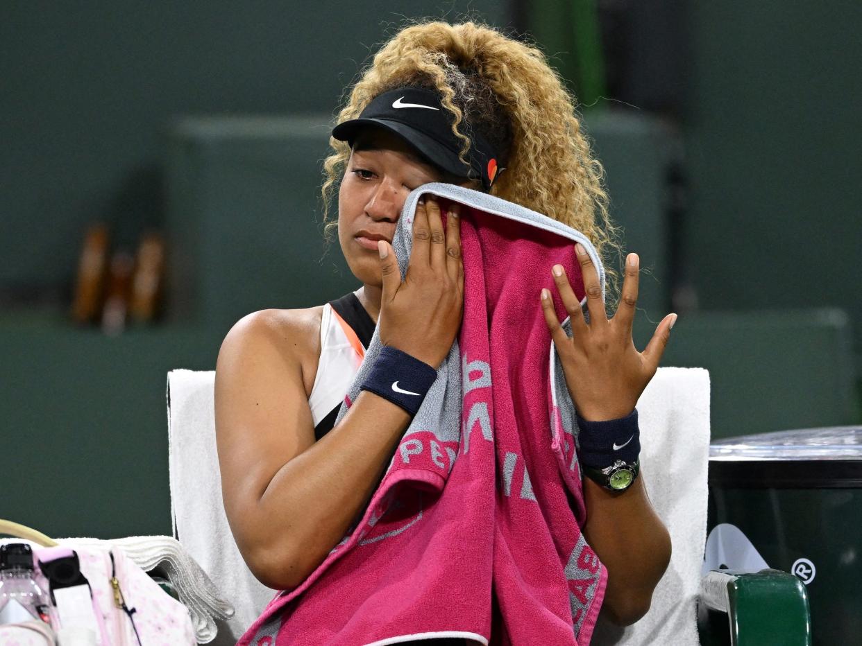 Naomi Osaka wipes her eyes while crying at Indian Wells.