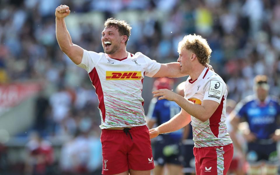 Will Evans (L) and Louis Lynagh of Harlequins celebrate victory at the final whistle during the Investec Champions Cup Quarter Final match between Union Bordeaux Begles and Harlequins at Stade Chaban-Delmas on April 13, 2024 in Bordeaux, France