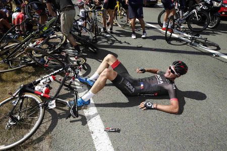 Bora-Argon 18 rider Dominik Nerz of Germany lies on the ground after a fall during the 159,5 km (99 miles) third stage of the 102nd Tour de France cycling race from Anvers to Huy, Belgium, July 6, 2015. REUTERS/Benoit Tessier