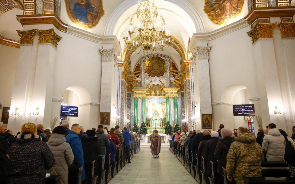 Ukrainians celebrating Christmas Mass on Sunday in Lviv