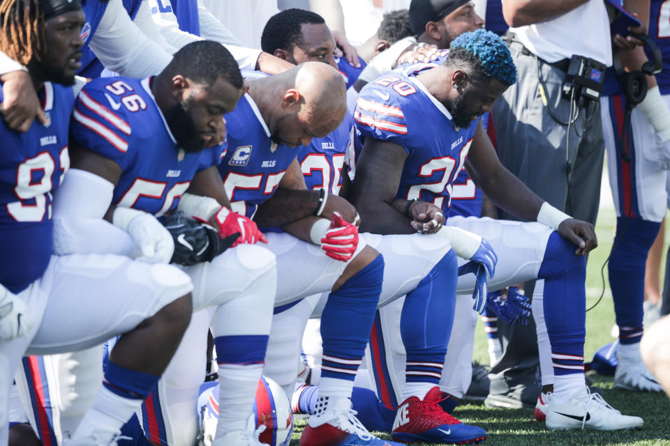 Buffalo Bills players knelt during the national anthem before their game against the Denver Broncos on Sunday, Sept. 24.&nbsp; (Photo: Brett Carlsen/Getty Images)