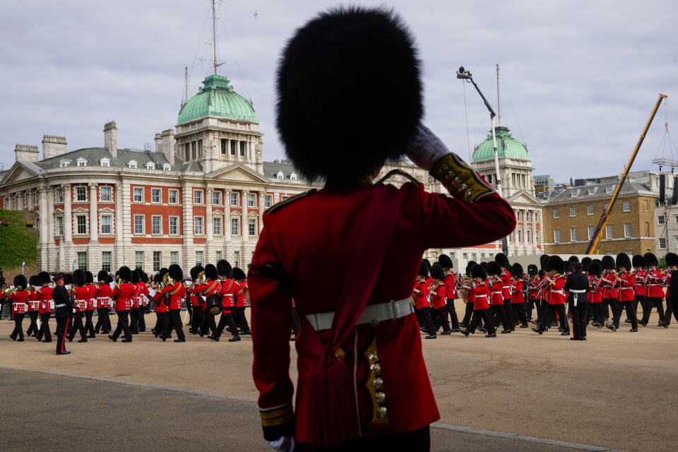 A Guardsman salutes as the coffin of Queen Elizabeth II is pulled on a gun carriage through the streets of London, from Westminster Abbey to Wellington Arch.<span class="copyright">Kin Cheung—WPA Pool/Getty Images</span>