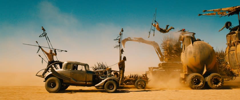 ***SUNDAY CALENDAR SNEAKS STORY FOR APRIL 26, 2015. DO NOT USE PRIOR TO PUBLICATION**********TOM HARDY (tied to front of car) as Max Rockatansky in Warner Bros. Pictures' and Village Roadshow Pictures' action adventure movie "MAD MAX: FURY ROAD," a Warner Bros. Pictures release. Photo Courtesy of Warner Bros. Pictures.