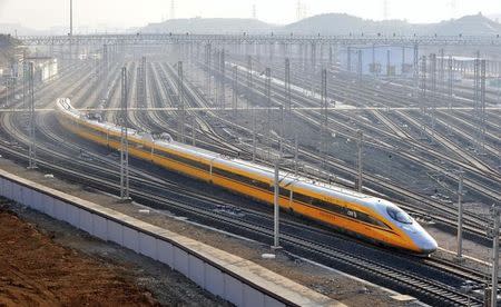 A CRH (China Railway High-speed) Harmony bullet inspection train leaves a train station for a railway inspection assignment, in Guiyang, Guizhou province October 8, 2014. REUTERS/Stringer