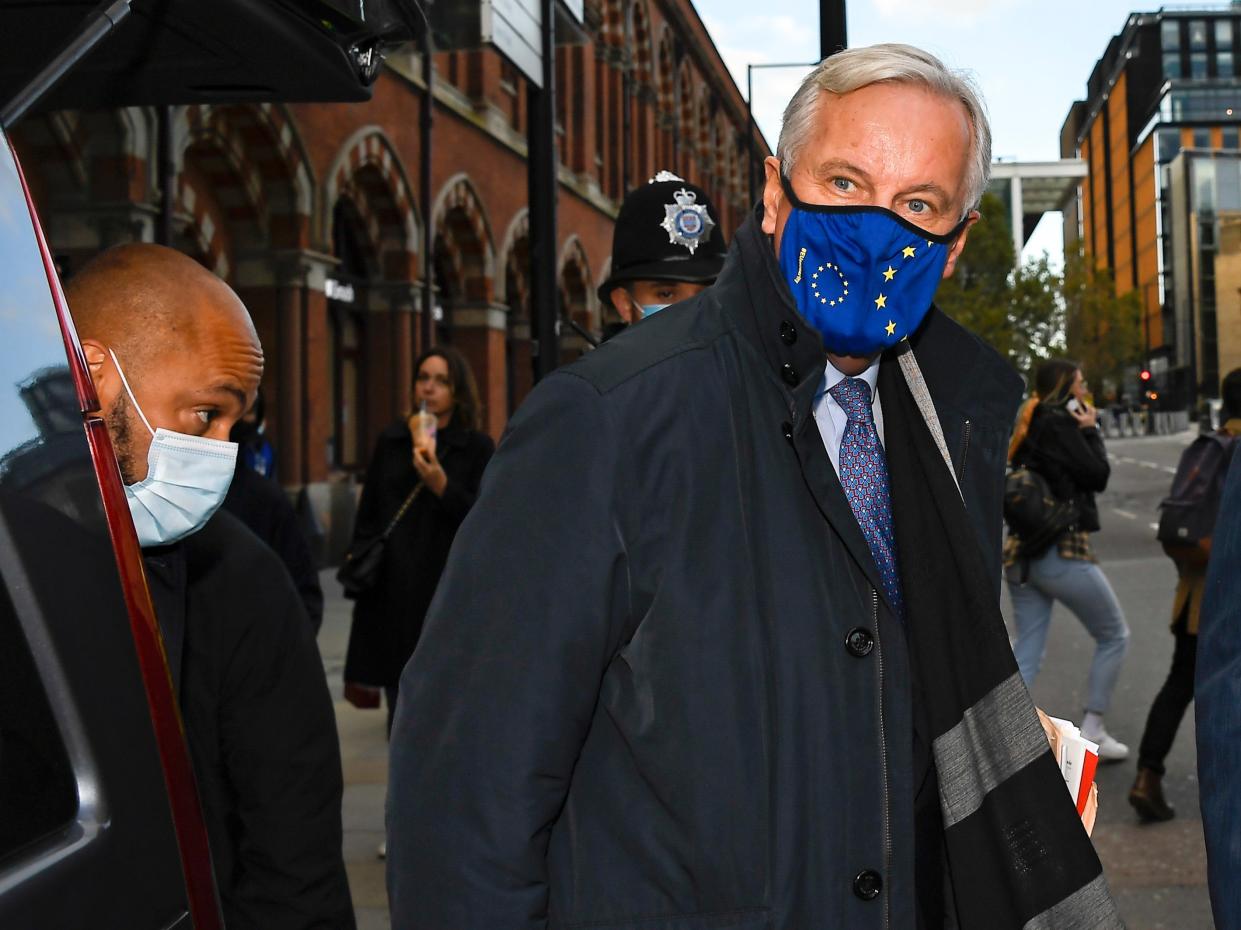 EU Chief negotiator Michel Barnier wears a face mask as he arrives at St Pancras station (AP)