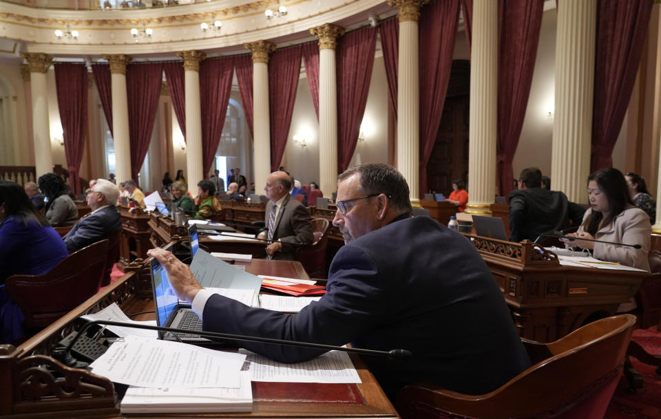 State Sen. Brian Dahle, R-Bieber, works at his desk during the Senate session at the Capitol in Sacramento, Calif., Tuesday, Sept. 12, 2023. Lawmakers are voting on hundreds of bills before the legislative session concludes for the year on Thursday. (AP Photo/Rich Pedroncelli)