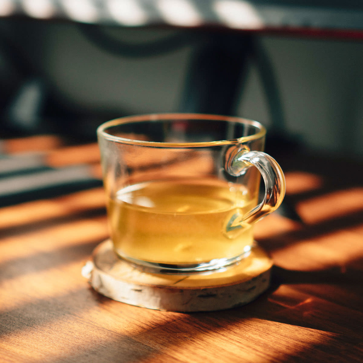 glass mug of tea in the morning light