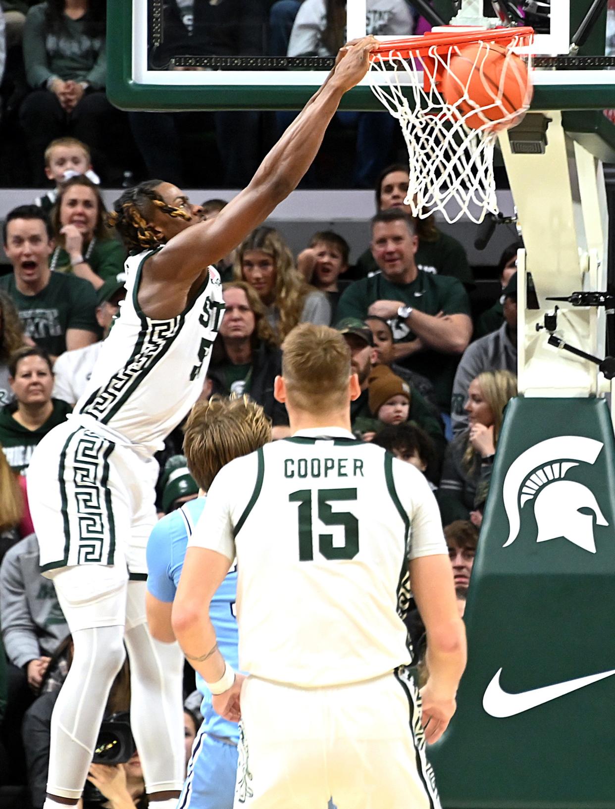 Michigan State Spartans forward Coen Carr (55) dunks against the Indiana State Sycamores during the first half at Breslin Center in East Lansing on Saturday, Dec. 30, 2023.