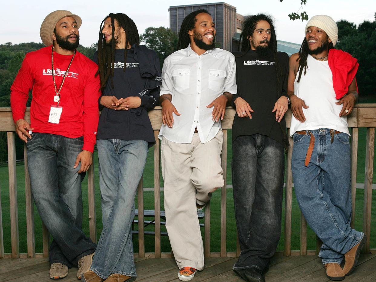 Kymani, Julian, Ziggy, Damian and Stephen Marley sons of Bob Marley pose for a photo after their performance at the "Roots, Rock, Reggae Tour 2004" at the Filene Center August 8, 2004 in Vienna, Virginia.