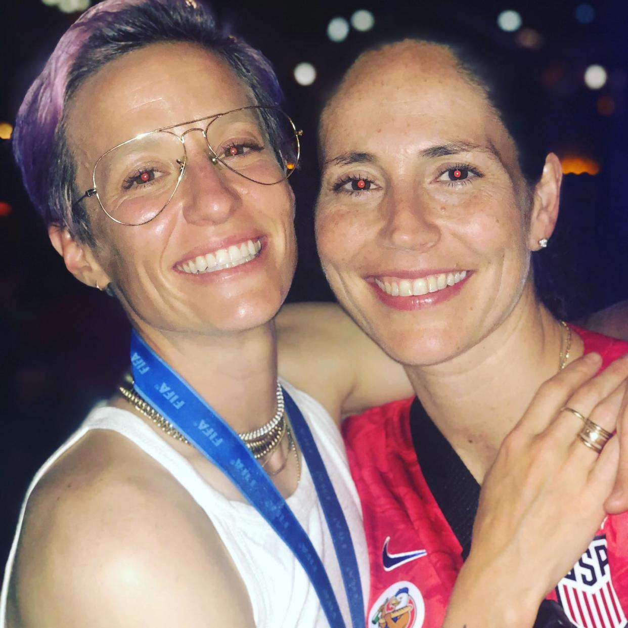 Megan Rapinoe poses for a photo with her girlfriend, WNBA star Sue Bird, after the USWNT historic national team. (Credit: Megan Rapinoe/Instagram)