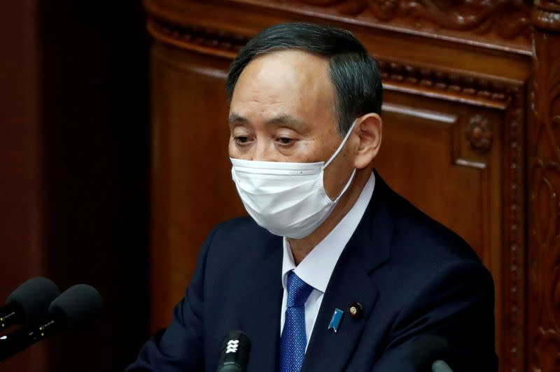 FILE PHOTO: Japan's PM Suga delivers policy speech at opening of Lower House parliamentary session in Tokyo