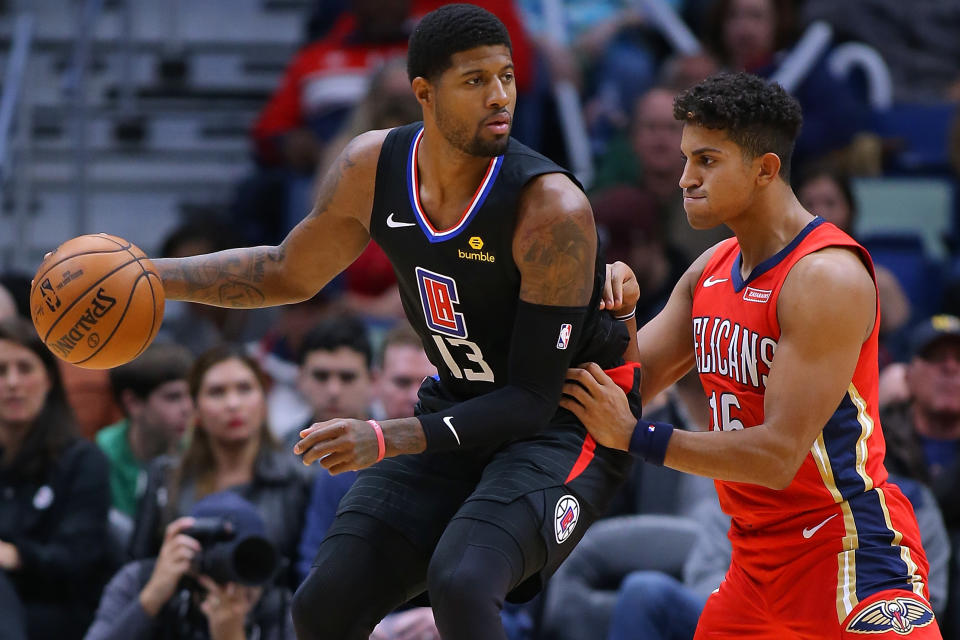 Paul George drives against Frank Jackson of the New Orleans Pelicans during the first half of their game on Thursday night at the Smoothie King Center.