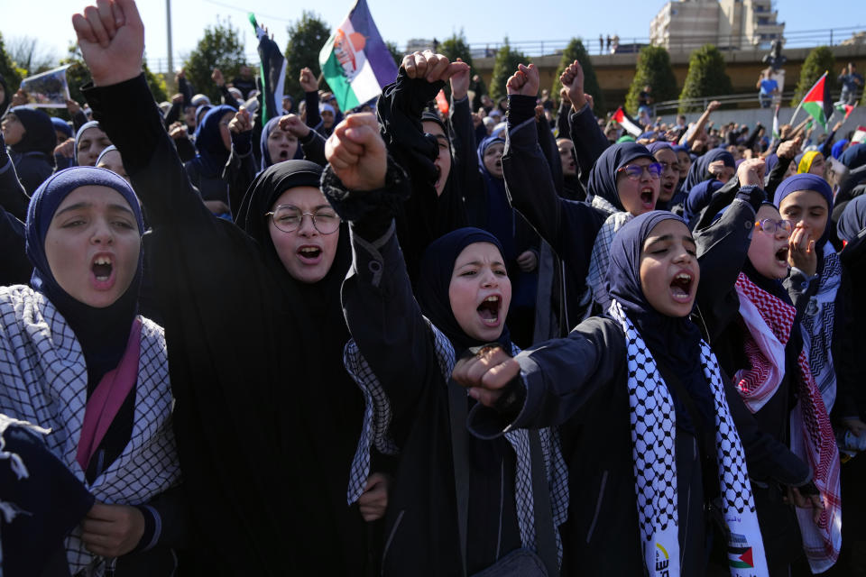 Lebanese students chant slogans during a protest, in front of the headquarters of U.N. Economic and Social Commission for Western Asia (ESCWA) in Beirut, Lebanon, Thursday, Nov. 9, 2023. Hundreds of students gathered to denounce Israel's ongoing attacks on the Gaza Strip and mourn the death of Palestinian children as well as three sisters who were killed in Lebanon over the weekend. (AP Photo/Bilal Hussein)