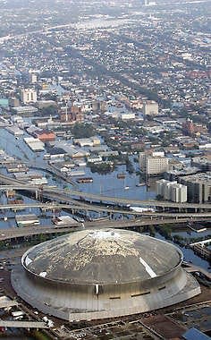 The Louisiana Superdome in New Orleans, damaged by Hurricane Katrina, is surrounded by floodwaters in this photo from Aug. 30, 2005.