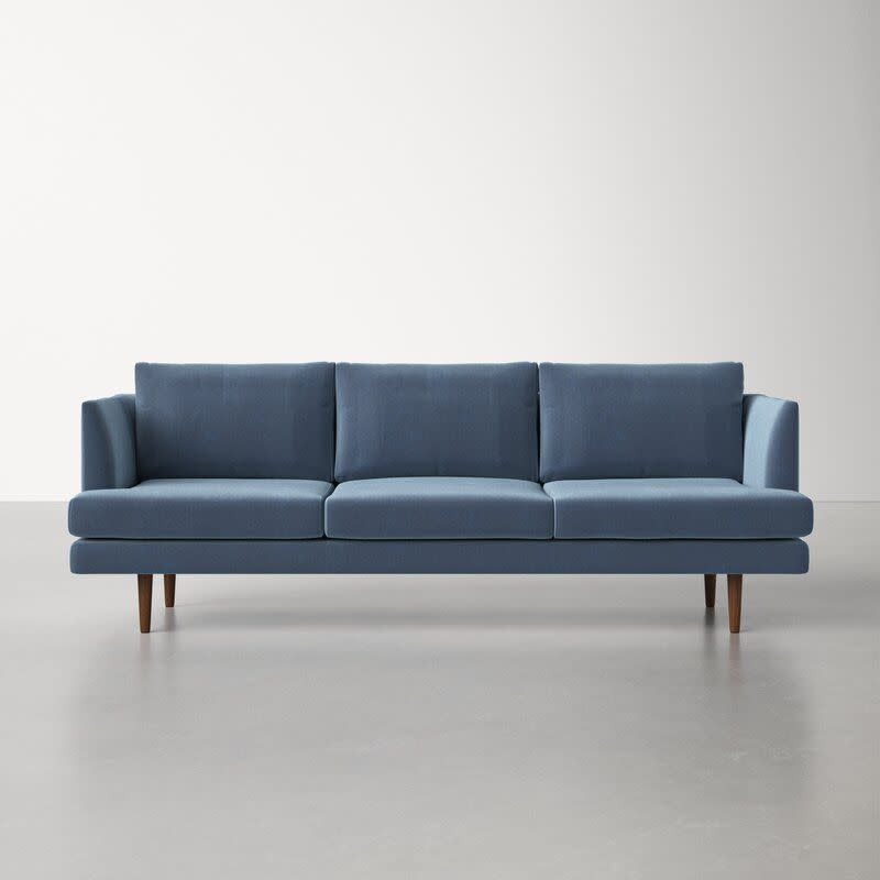 <p><strong>AllModern</strong></p><p>wayfair.com</p><p><strong>$1260.00</strong></p><p>This sofa from Wayfair's <a href="https://www.housebeautiful.com/design-inspiration/a22877276/mid-century-modern-design-explained/" rel="nofollow noopener" target="_blank" data-ylk="slk:midcentury modern" class="link ">midcentury modern</a> brand, <a href="https://go.redirectingat.com?id=74968X1596630&url=https%3A%2F%2Fwww.allmodern.com%2F&sref=https%3A%2F%2Fwww.housebeautiful.com%2Fshopping%2Fbest-stores%2Fg41311875%2Fwayfair-surplus-sale-2022%2F" rel="nofollow noopener" target="_blank" data-ylk="slk:AllModern" class="link ">AllModern</a>, would make a fabulous anchor to any contemporary-style living room. The upholstery is a tightly woven polyester blend that looks like velvet, but is much easier to maintain—it's water-resistant, stain-resistant, and won't scratch easily from animal claws. This sofa comes in a variety of cool-neutral hues including the dust blue color pictured here.</p>