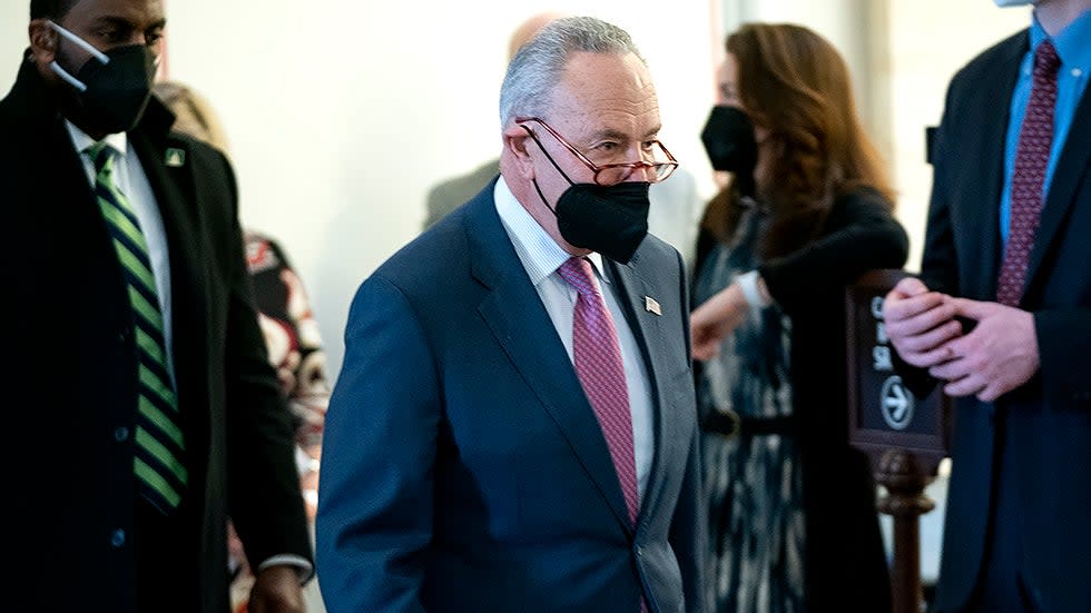 Majority Leader Charles Schumer (D-N.Y.) arrives before President Biden arrives for a Democratic caucus luncheon at the Senate Russell Office building to discuss voting rights and filibuster reform on Thursday, January 13, 2022.