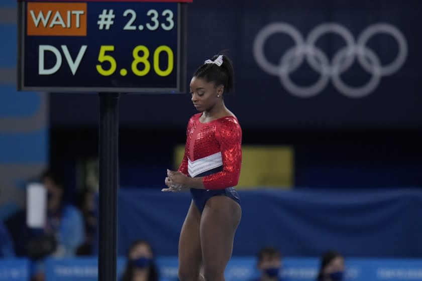 Simone Biles, of the United States, waits to perform on the vault during the artistic gymnastics women's final at the 2020 Summer Olympics, Tuesday, July 27, 2021, in Tokyo. (AP Photo/Gregory Bull)