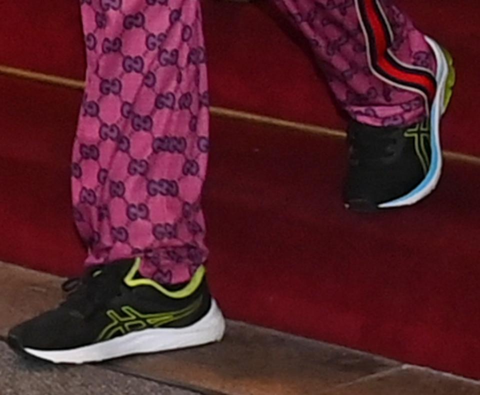 Elton John Nails High-Low Dressing in Gucci Sweatpants & Asics Sneakers