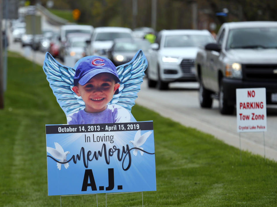 FILE - In this May 3, 2019, file photo, cars line up as mourners head to visitation services for AJ Freund at Davenport Funeral Home in Crystal Lake, Ill. JoAnn Cunningham who pleaded guilty to first-degree murder in the beating death of AJ Freund, her 5-year-old son, faces a maximum sentence of 60 years in state prison when she returns to court on Thursday, July 16, 2020. (Brian Hill/The Daily Herald via AP, File)