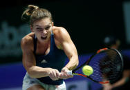 Tennis - Singapore WTA Finals Round Robin Singles - Singapore Indoor Stadium, Singapore - 27/10/2016 - Simona Halep of Romania in action against Dominika Cibulkova of Slovakia REUTERS/Edgar Su