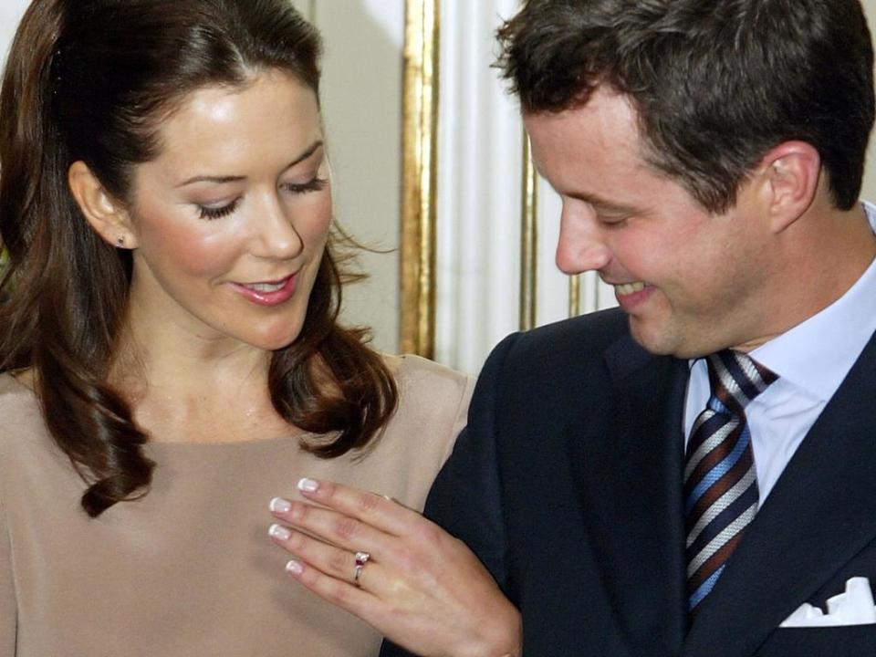 COPENHAGEN, DENMARK - OCTOBER 8: Mary Elizabeth Donaldson and His Royal Highness Crown Prince Frederik of Denmark show their engagement ring to the media during a press conference at Fredensborg Castle October 8, 2003 in Copenhagen, Denmark. The pair announced their engagement, with the wedding set for May 14, 2004. (Photo by Scott Barbour/Getty Images)