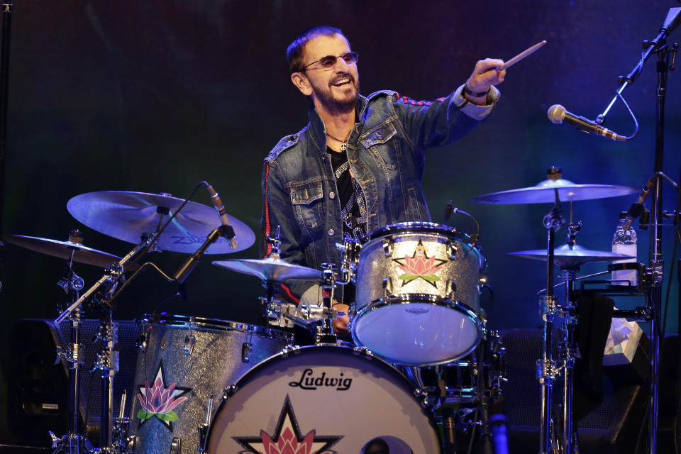 FILE - Ringo Starr plays as part of a concert celebrating the 50th anniversary of Woodstock in Bethel, N.Y., Aug. 16, 2019. Starr will receive an honorary degree Thursday, June 2, 2022, from Berklee College of Music in Boston. (AP Photo/Seth Wenig, File)