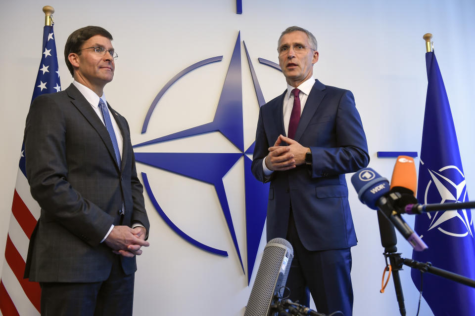 Acting U.S. Secretary for Defense Mark Esper, left, speaks during a press point with NATO Secretary General Jens Stoltenberg prior to a meeting of NATO defense ministers at NATO headquarters in Brussels, Wednesday, June 26, 2019. (John Thys, Pool Photo via AP)