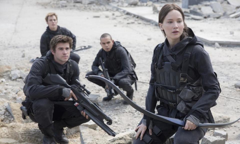 Liam Hemsworth, Sam Clafin, Evan Ross and Jennifer Lawrence in The Hunger Games: Mockingjay, Part 2.