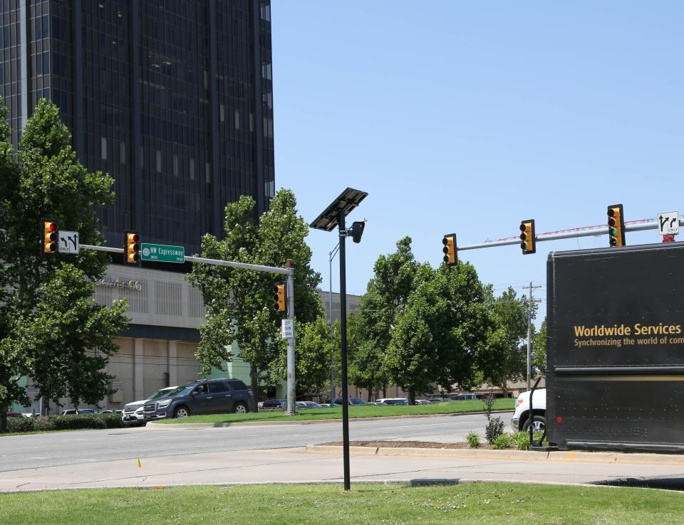 A Flock automatic license plate reader camera, owned by Penn Square Mall, stands near the south mall entrance.