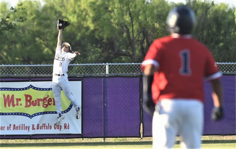 Wylie left fielder Braden Regala, left, makes a leaping grab to rob Isaac Garza of a three-run home run in the fourth inning. Wylie beat Plainview 15-5 in six innings in the Region I-5A bi-district playoff opener  May 4 at Wylie High School.