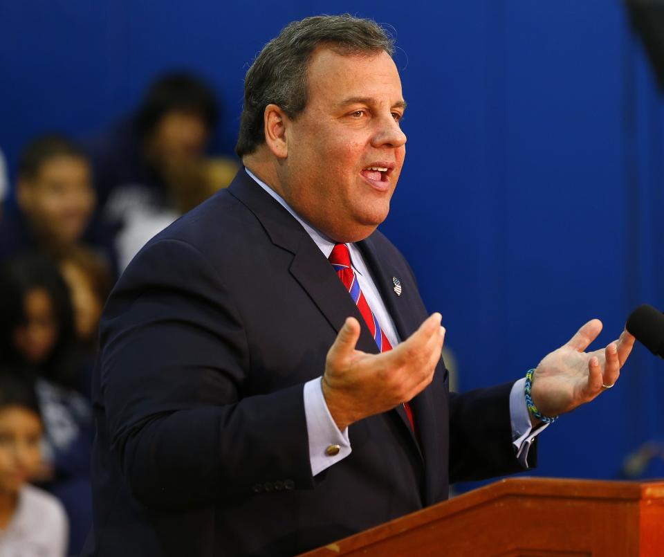 New Jersey Gov. Chris Christie talks to the media as he visits Jose Marti Freshman Academy in Union City, N.J. Wednesday, Nov. 6, 2013, the day after defeating Democratic challenger Barbara Buono to win his second term as governor. 