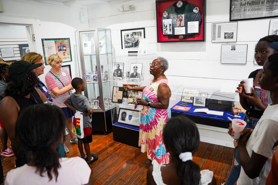 Lee County Black History Society Treasurer Harriet Myers gives a tour of the Williams Academy Museum during the 11th annual Juneteenth Community Celebration at Roberto Clemente Park in Fort Myers on June 17.