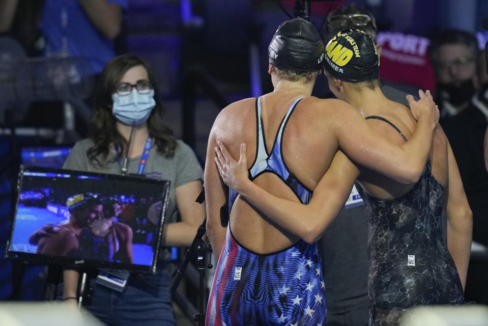 Katie Ledecky congratulates Katie Grimes after the women's 800 freestyle during wave 2 of the U.S. Olympic Swim Trials on Saturday, June 19, 2021, in Omaha, Neb. (AP Photo/Jeff Roberson)