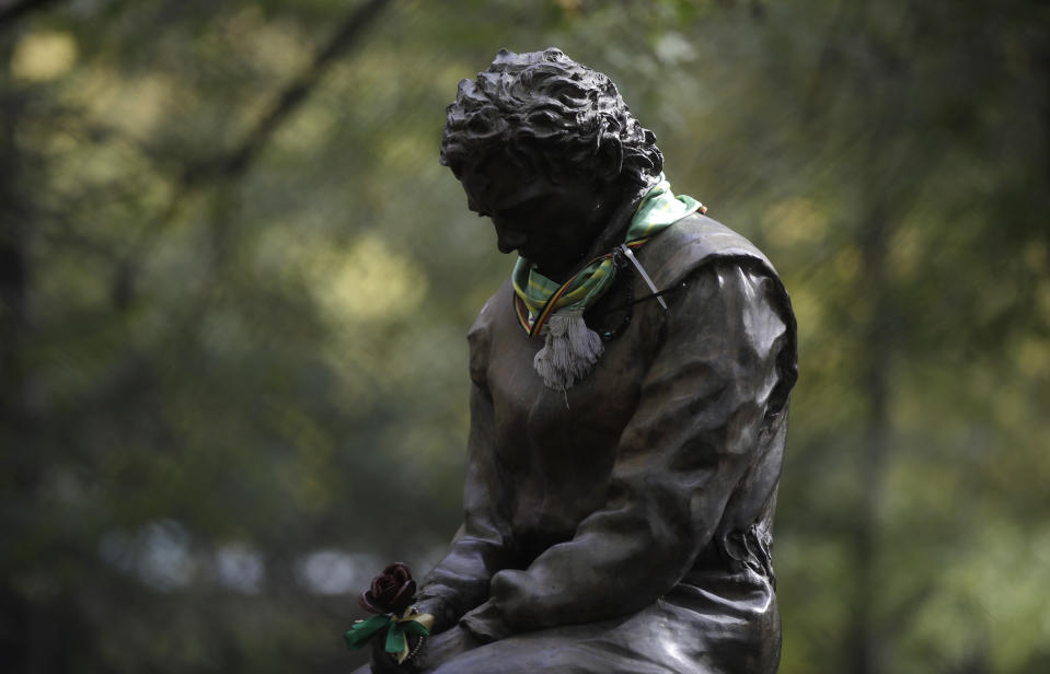 FILE - A scarf has been placed on a statue of Brazilian race car driver Ayrton Senna ahead of Sunday's Emilia Romagna Formula One Grand Prix, at the Dino and Enzo Ferrari racetrack, in Imola, Italy, Friday, Oct. 30, 2020. The 30th anniversary of Ayrton Senna’s death is commemorated on Wednesday, May 1, 2024, with a memorial on the Imola track where he crashed during the 1994 San Marino Grand Prix. (AP Photo/Luca Bruno, File)