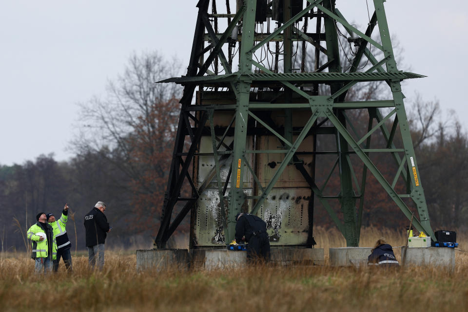 Police works next to a damaged pylon after Tesla Gigafactory in Gruenheide near Berlin halted production and was left without power after suspected arson set an electricity pylon ablaze, near Steinfurt, Germany, March 5, 2024. REUTERS/Lisi Niesner