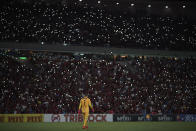 Flamengo's goalkeeper wears a jersey with the name of the young goalkeeper Christian, one of the 10 teenage players killed by a fire at the Flamengo training center last Friday, ahead of a soccer match between Flamengo and Fluminense, at the Maracana Stadium, in Rio de Janeiro, Brazil, Thursday, Feb. 14, 2019. (AP Photo/Leo Correa)