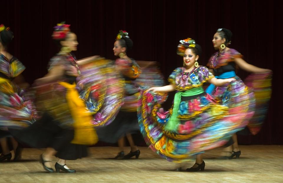 Members of the Ballet Folklorico de Frank Zapata perform a traditional dance from the Chiapas region of Mexico at the Voices of our Ancestors performance Sept. 19, 2015, as a part of the University of the Pacific's Latino Heritage Month at Faye Spanos Concert Hall. A slow shutter speed blurs the motion of most of the dancers. One dancer was still just long enough to remain sharp for a second.