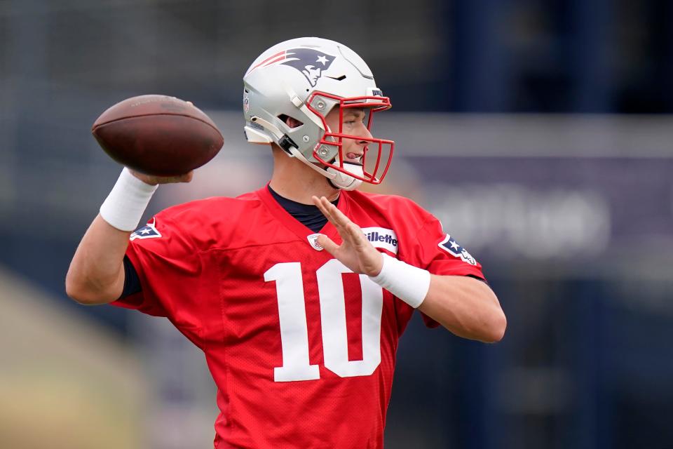 New England Patriots quarterback Mac Jones winds up to pass the ball during practice, Tuesday, Aug. 31, 2021, in Foxborough, Mass. The Patriots released quarterback Cam Newton on Tuesday, Aug. 31, clearing the way for rookie Mac Jones to open the season as New England's quarterback.