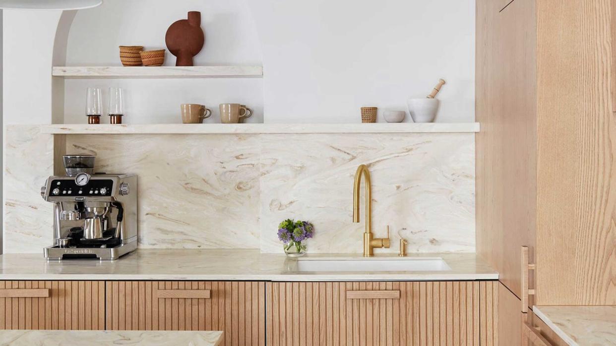  A kitchen with a corian countertop. 