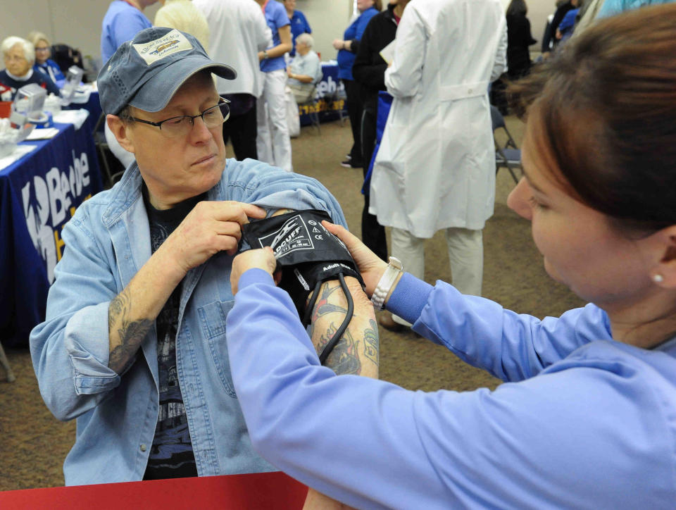 Christina Hanna, a student at Beebe Healthcare Margaret H. Rollins School of Nursing, checks the blood pressure of Stephen Ridgway of Long Neck at the Beebe Healthcare health fair at the Rehoboth Beach Convention Center in this file photo.