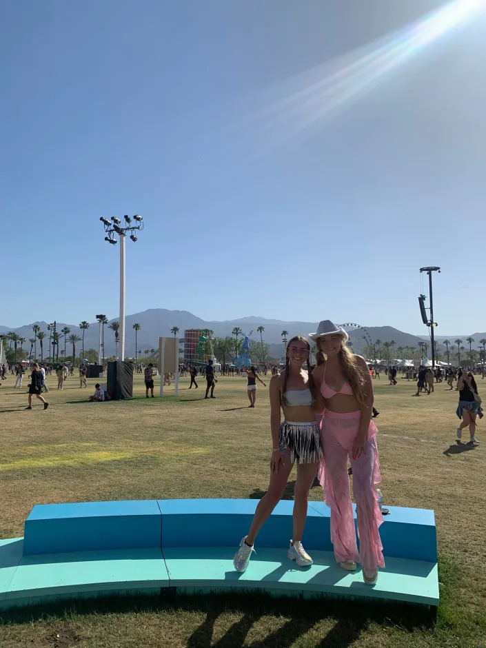 The author and her sister standing on a platform with the vista of Coachella in the background