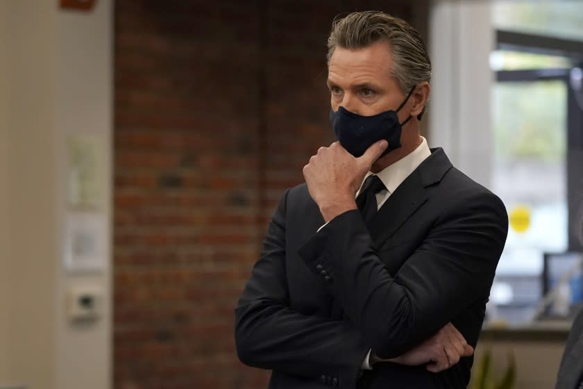 Gov. Gavin Newsom listens to speakers at a news conference in Oakland, Calif., Monday, July 26, 2021. (AP Photo/Jeff Chiu)