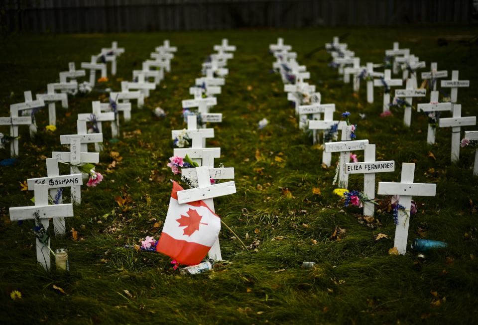 Crosses are displayed in memory of the elderly who died from COVID-19 at a long-term care facility in Mississauga, Ont., in November 2020. THE CANADIAN PRESS/Nathan Denette