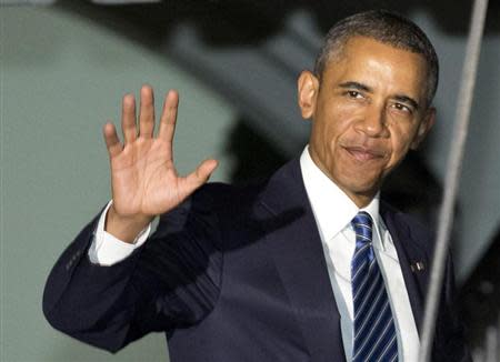 U.S. President Barack Obama waves as he walks to Marine One before departing for Sweden and the G20 Summit in Russia from the White House in Washington September 3, 2013. REUTERS/Joshua Roberts