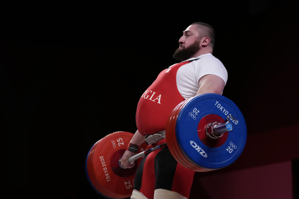 FILE - Lasha Talakhadze of Georgia competes in the men's +109kg weightlifting event, at the 2020 Summer Olympics, Wednesday, Aug. 4, 2021, in Tokyo, Japan. (AP Photo/Luca Bruno, File)
