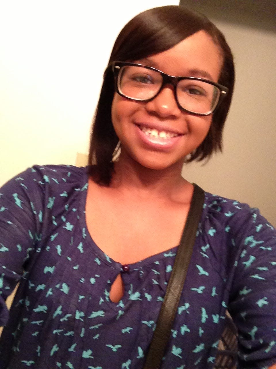 Taneia Surles in August, 2013, wearing glasses and looking at the camera